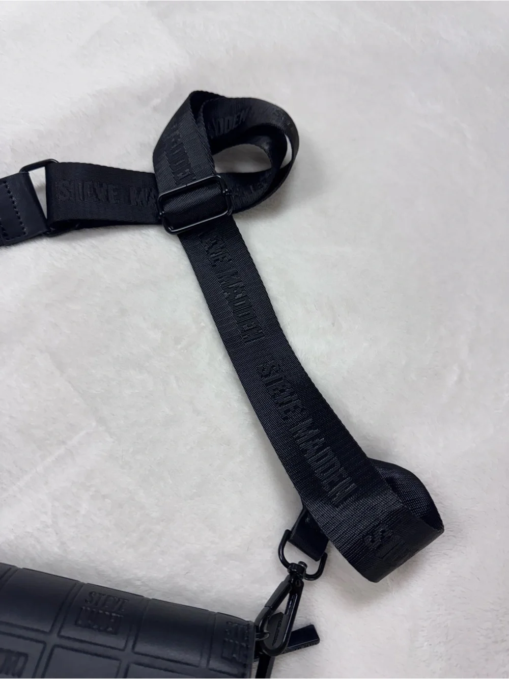 Steve Madden Black Embossed Logo Crossbody Bag.